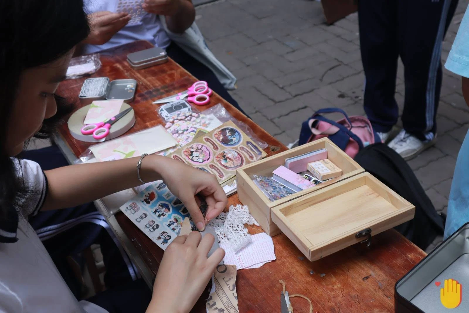 Students making handmade decorations together
