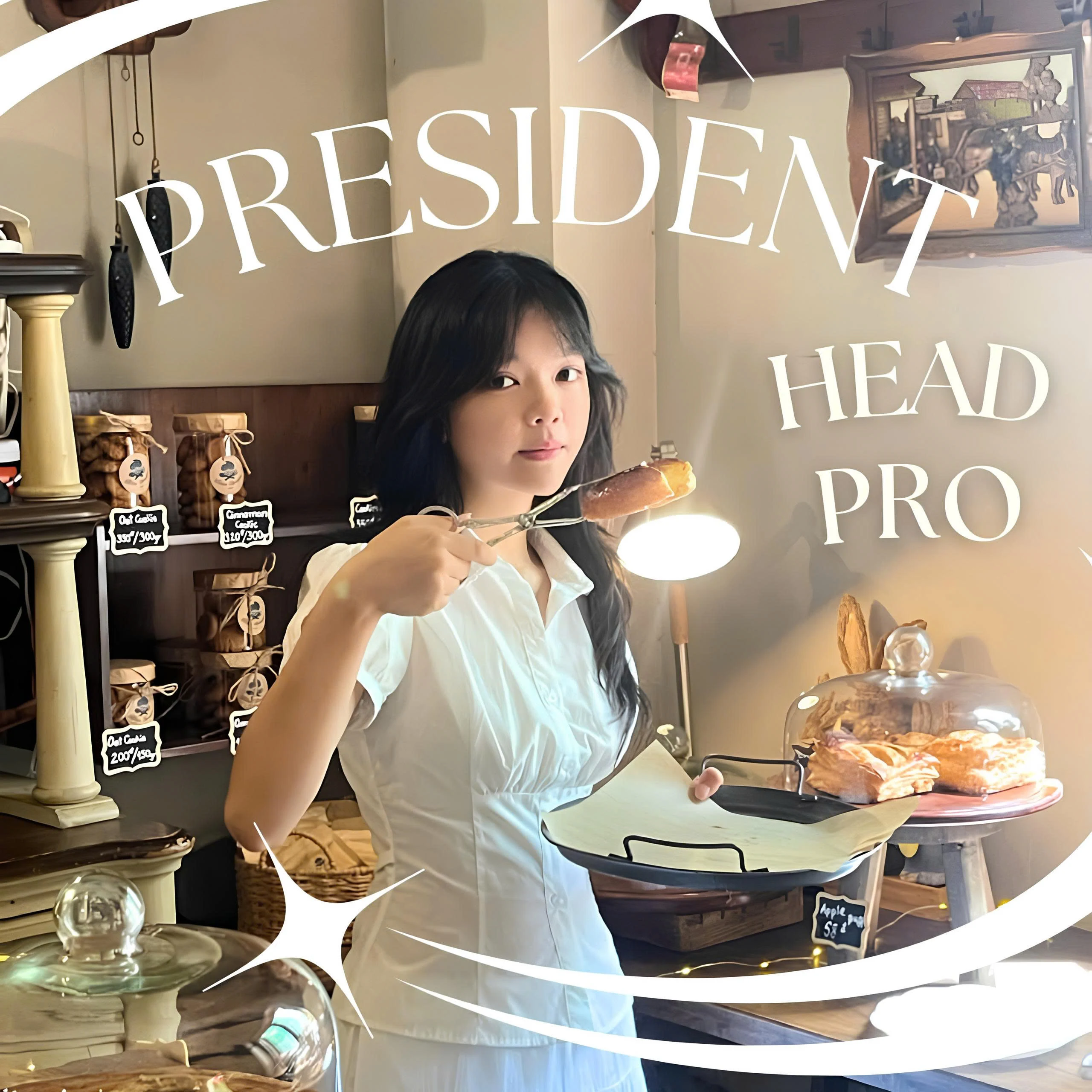 Ngân holding a tray of pastries in the Handmade Club president portrait
