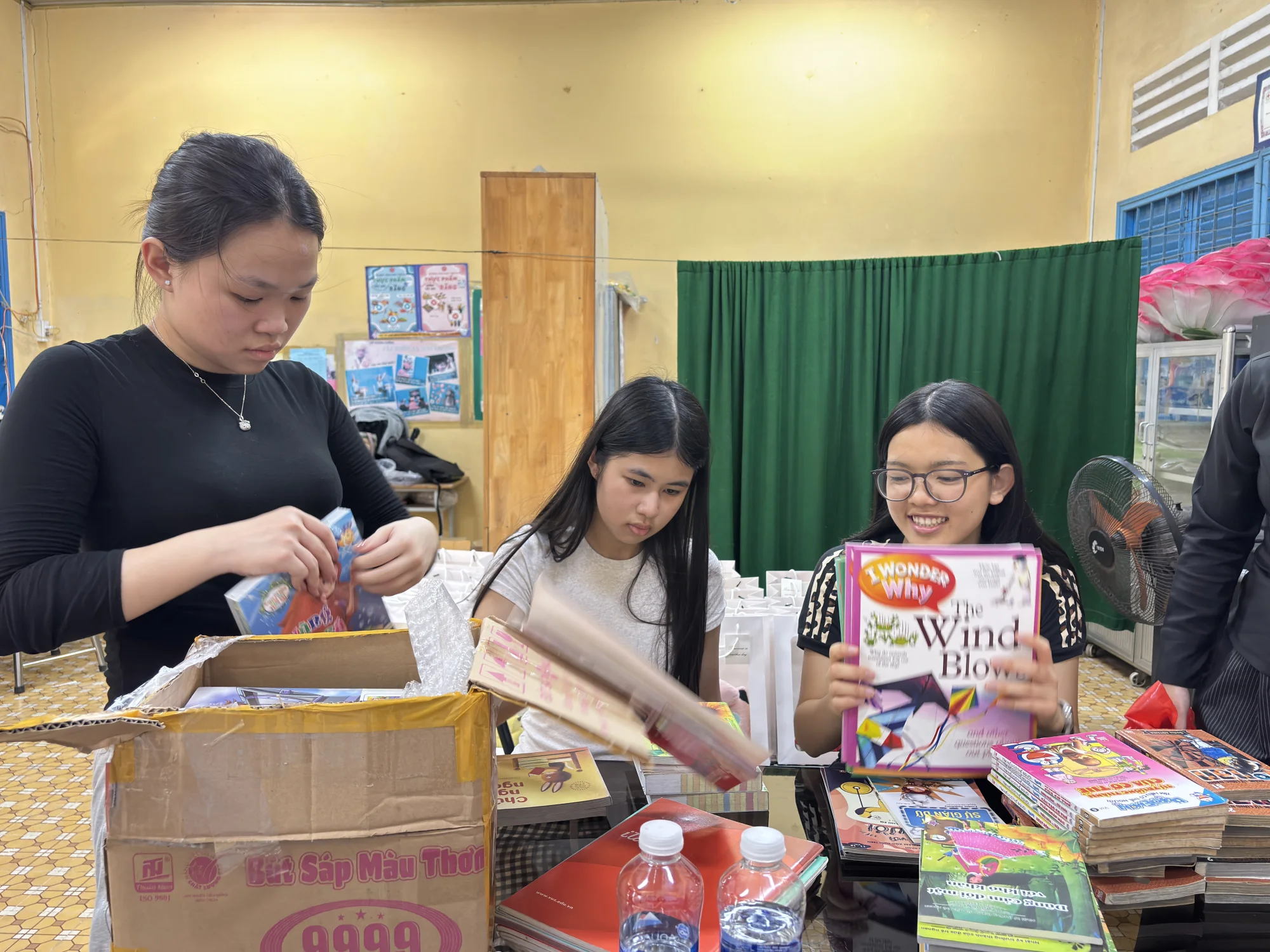 Team members sorting books for the Green Library
