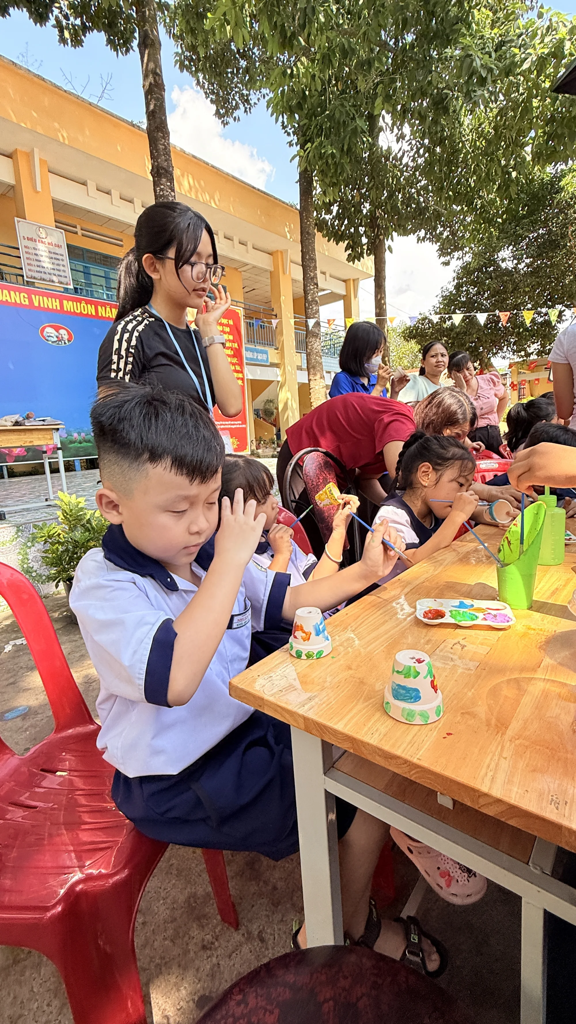 Students painting during a Plant For Change workshop