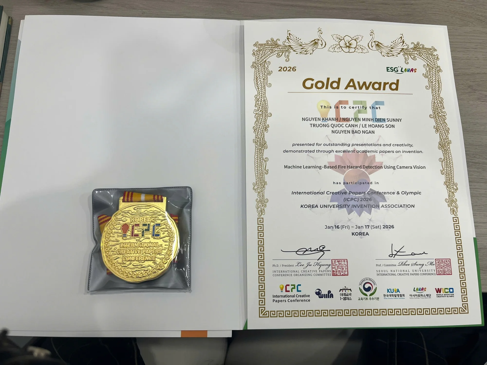Gold award certificate and medal for the fire detection research project